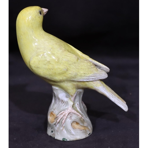 151 - A 19th Century Meissen figure of a yellow bird perched upon trunk (trunk restored), 10cm high