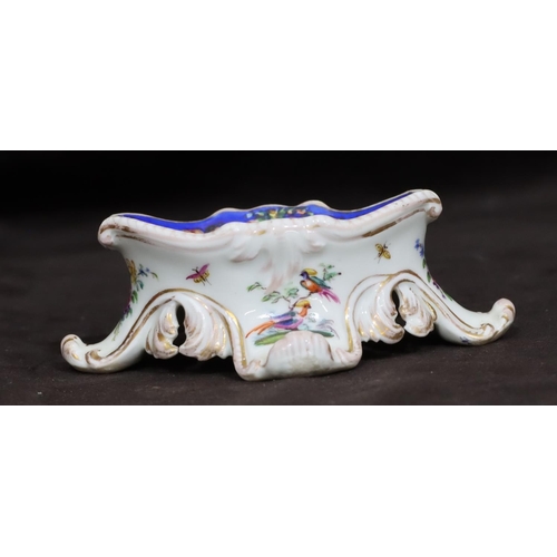 153 - A Meissen oval salt on white ground, later decorated with multi-coloured figure, bird and scroll dec... 