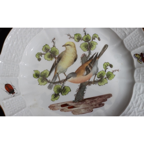 154 - A 19th Century Meissen round scallop shaped plate on white ground with multi-coloured perched bird a... 