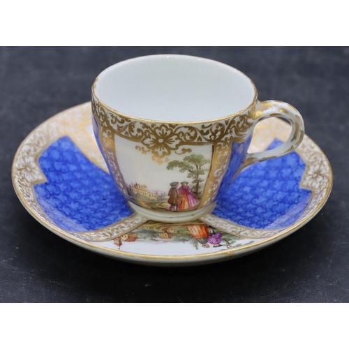 170 - A small Continental porcelain cup and saucer on blue and white ground with hand painted figure, land... 