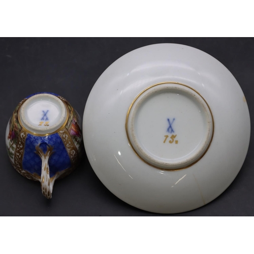 170 - A small Continental porcelain cup and saucer on blue and white ground with hand painted figure, land... 