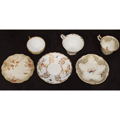 18 - A Rockingham 19th Century teacup and saucer on white and grey ground with multi-coloured bird, flora... 