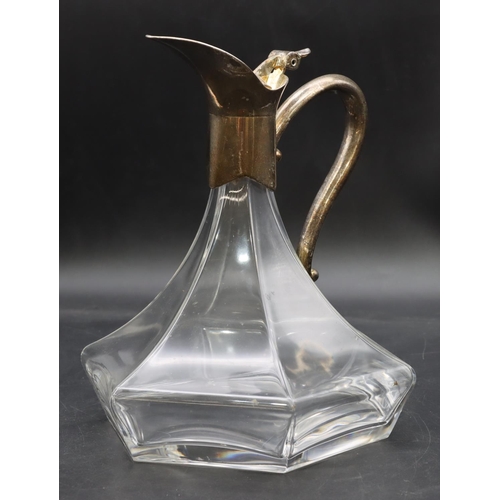 212 - An Arts & Crafts style glass bulbous shaped claret jug with silver plated neck, hinged lid and scrol... 