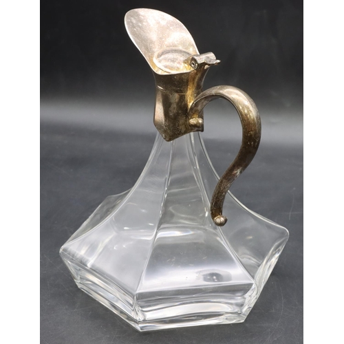 212 - An Arts & Crafts style glass bulbous shaped claret jug with silver plated neck, hinged lid and scrol... 