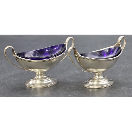 213 - A pair of London silver Victorian oval salts with blue glass liners on oval sweeping bases, 3oz, Lon... 