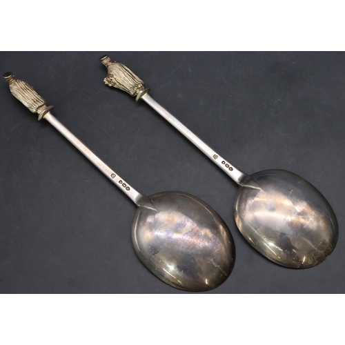 215 - A pair of Victorian silver gilt Apostle tablespoons in fitted black leather case, London 1890, 4.5oz