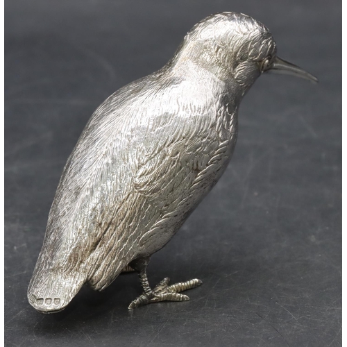 216 - An Elizabeth II silver model of a bird with allover chased decoration, London 1958, maker's mark EB,... 