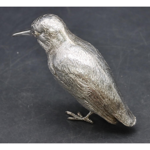 216 - An Elizabeth II silver model of a bird with allover chased decoration, London 1958, maker's mark EB,... 