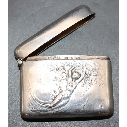 218 - A Victorian Art Nouveau silver concave shaped vesta case with embossed figure of a female nude, hing... 