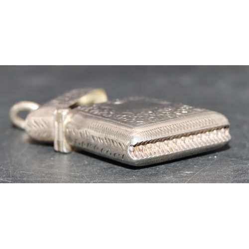 221 - A small Victorian silver vesta case with allover chased and leaf decoration and hinged lid, Birmingh... 