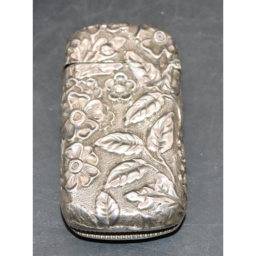 224 - A Victorian tall silver vesta case with floral and leaf decoration and hinged lid, Birmingham 1889, ... 