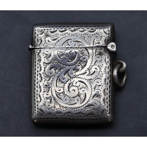 228 - An Edwardian silver vesta case with chased scroll and leaf decoration and hinged lid, Birmingham 190... 