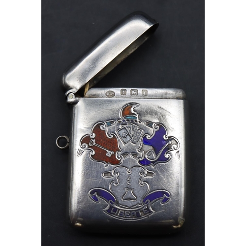 229 - An Edwardian plain Birmingham silver vesta case with hinged lid and enamelled crest motif inscribed ... 