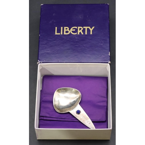 232 - A Liberty & Co Scottish silver caddy spoon inset with blue cabochon, 8.5cm wide, 0.56oz (with Libert... 