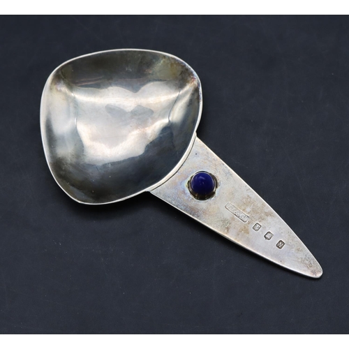 232 - A Liberty & Co Scottish silver caddy spoon inset with blue cabochon, 8.5cm wide, 0.56oz (with Libert... 