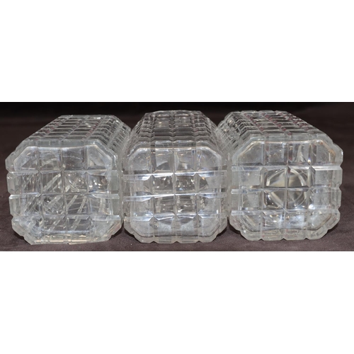 27 - A set of 3 cut glass square decanters with thumb pattern necks and stoppers, 23cm high