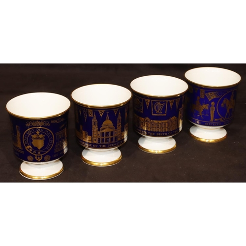 3 - 4 Coalport commemorative bone china goblets on white and blue ground with gilt decoration, 12cm high... 