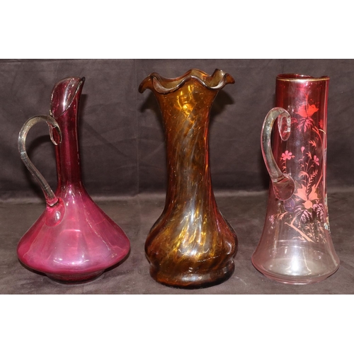 30 - A ruby tall glass jug with painted floral and leaf decoration, 33cm high, a ruby glass bulbous shape... 