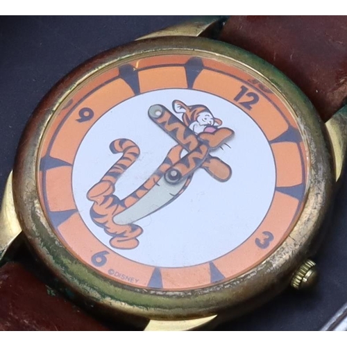 382 - 3 children's watches, a Disney watch depicting Tigger with leather strap (boxed), A Mil-Looney-UM wa... 