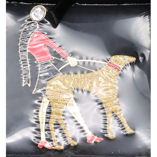 386 - Butler & Wilson brooch in the form of a lady walking a dog (Boxed and unopened)