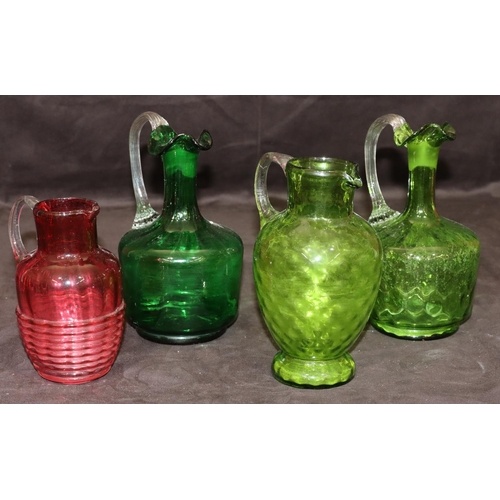 39 - 3 green glass Victorian round bulbous shaped jugs with reeded handles, 19cm high and a smaller Victo... 