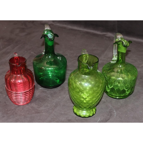 39 - 3 green glass Victorian round bulbous shaped jugs with reeded handles, 19cm high and a smaller Victo... 