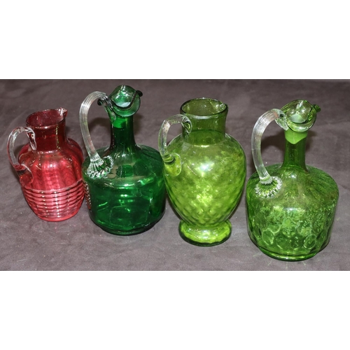 39 - 3 green glass Victorian round bulbous shaped jugs with reeded handles, 19cm high and a smaller Victo... 