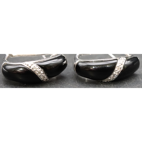 397 - A pair of 14ct white gold and black onyx earrings, 5.2 grams gross