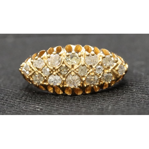 400 - A high carat gold boat shaped cluster ring set with 16 graduated diamonds, size P/Q, 4.7 grams, appr... 