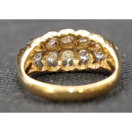 400 - A high carat gold boat shaped cluster ring set with 16 graduated diamonds, size P/Q, 4.7 grams, appr... 