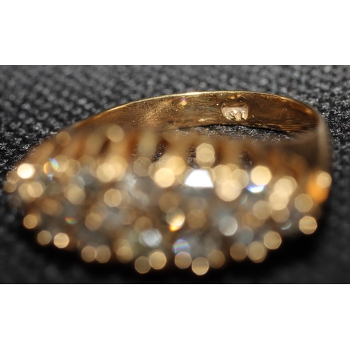 400 - A high carat gold boat shaped cluster ring set with 16 graduated diamonds, size P/Q, 4.7 grams, appr... 