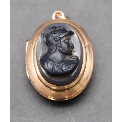 402 - A gold oval hardstone relief locket with raised head of a gentleman with monogram to reverse, 3.5cm ... 