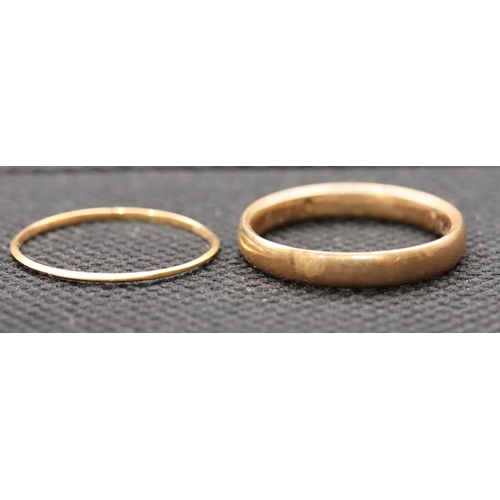 407 - A 9ct gold wedding ring, size L/M, 2.3 grams and a very thin 18ct gold wedding ring, size L/M, 0.3 g... 