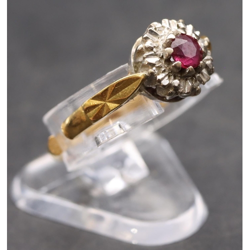 408 - An 18ct gold ladies' small cluster ring set with centre ruby surrounded by small diamonds (cut), siz... 