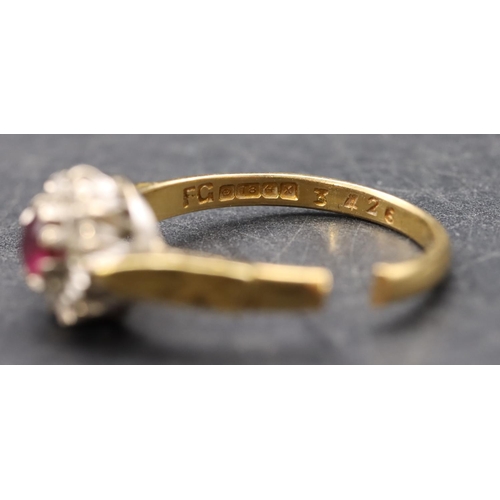 408 - An 18ct gold ladies' small cluster ring set with centre ruby surrounded by small diamonds (cut), siz... 