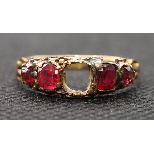 411 - A 15ct gold ladies' 5-stone ring (centre stone missing), flanked by 4 red stones, size O, 1.6 grams ... 