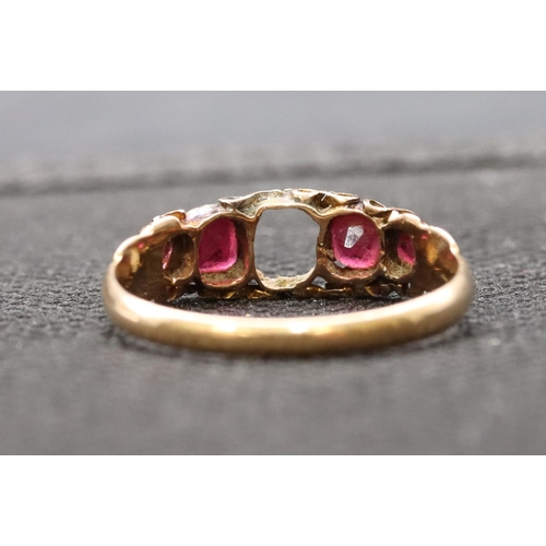 411 - A 15ct gold ladies' 5-stone ring (centre stone missing), flanked by 4 red stones, size O, 1.6 grams ... 