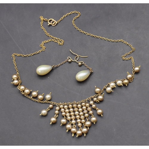 415 - An Edwardian pearl necklace and a pair of pearl earrings