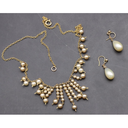 415 - An Edwardian pearl necklace and a pair of pearl earrings