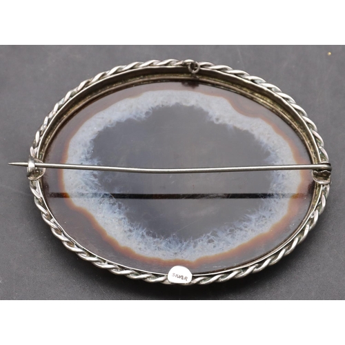 419 - A large oval silver agate brooch, 7.2cm wide, overall weight 34 grams