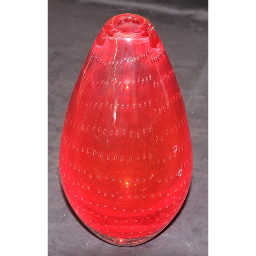 42 - A heavy red glass round bulbous thin necked vase with inner ball decoration, 25cm high