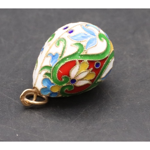 424 - A Russian enamelled and silver gilt pendant in the form of an egg, 3.3cm high