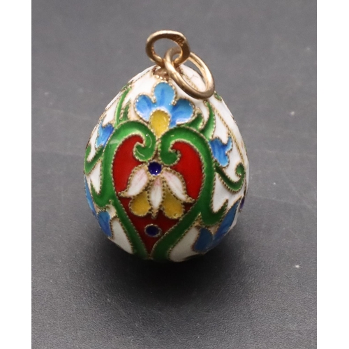 424 - A Russian enamelled and silver gilt pendant in the form of an egg, 3.3cm high