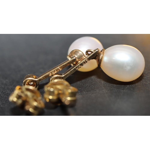 425 - A pair of 9ct gold ladies' pearl drop earrings mounted with small diamonds