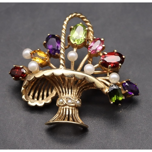 426 - A 9ct gold brooch in the form of a basket mounted with various coloured stones, overall weight 5.6 g... 