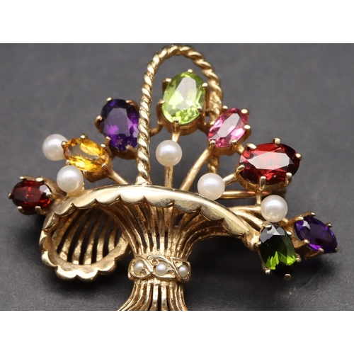 426 - A 9ct gold brooch in the form of a basket mounted with various coloured stones, overall weight 5.6 g... 