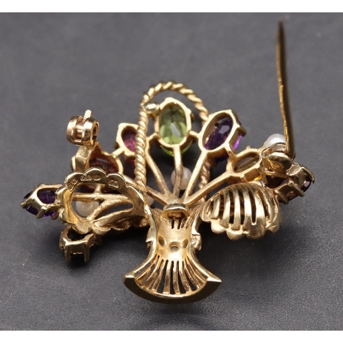 426 - A 9ct gold brooch in the form of a basket mounted with various coloured stones, overall weight 5.6 g... 