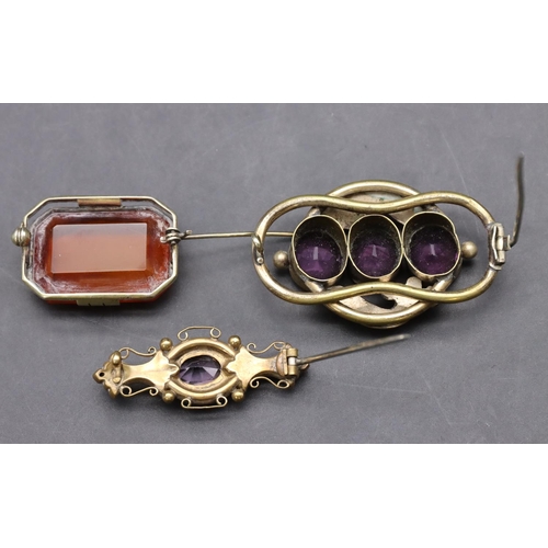 429 - 2 Victorian pinchbeck brooches set with purple stones and another silver gilt amber coloured brooch ... 