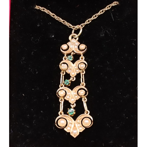 432 - A gold drop pendant set with half pearls and green stones with 9ct gold chain, overall weight 5.8 gr... 