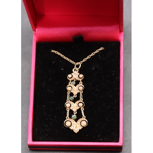 432 - A gold drop pendant set with half pearls and green stones with 9ct gold chain, overall weight 5.8 gr... 